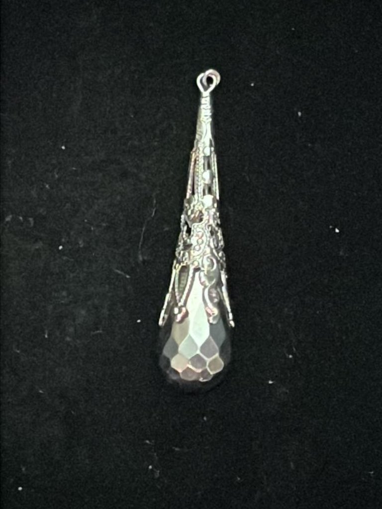 Dark Grey Faceted Teardrop In Elaborate Silver Tone Setting Pendant